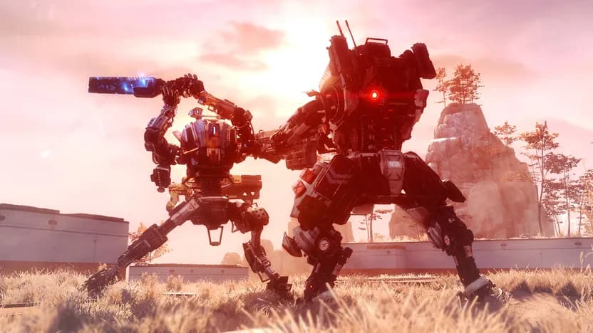 Titanfall 2 official screenshot of two Titans in a field at sunset